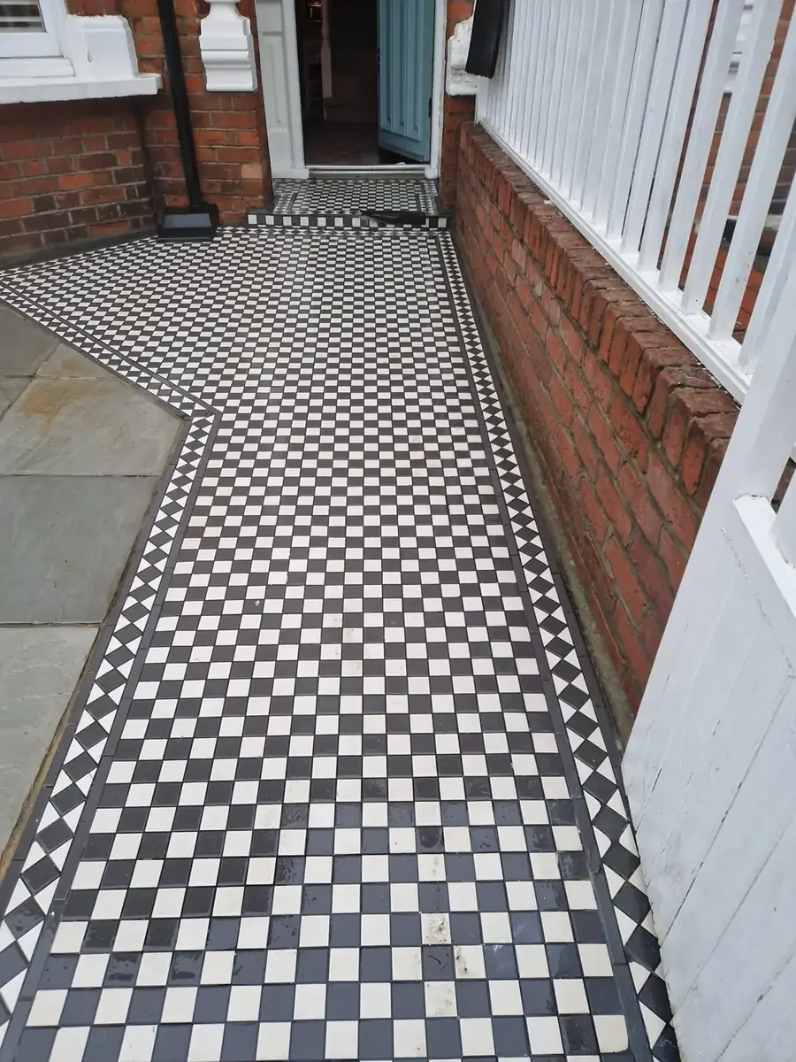 Pressure washing victorian tiled path in Acton, West London – after cleaning by URBNX