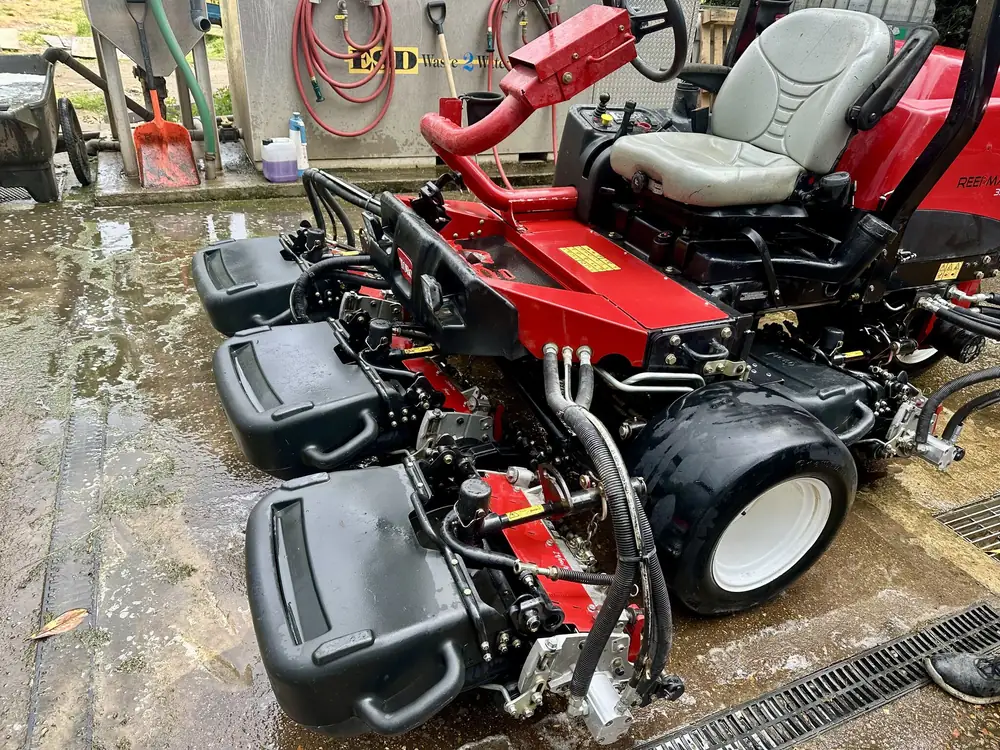 Toro Reelmaster 3550-D being cleaned in a wash bay