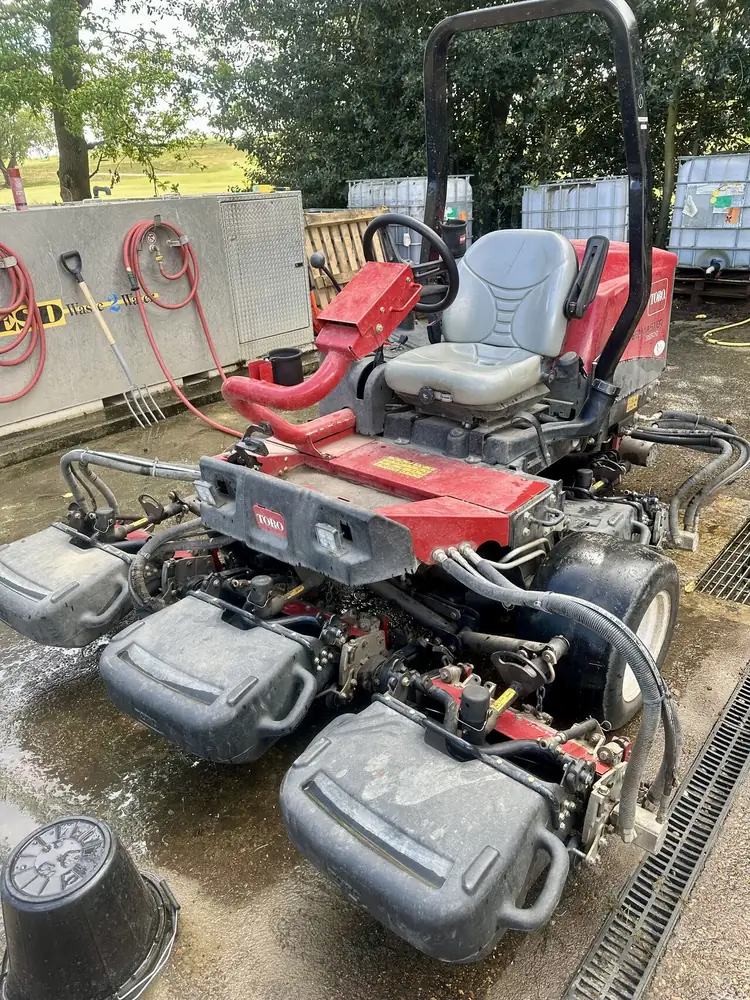 Toro Reelmaster 3550-D cylinder mower in a wash bay
